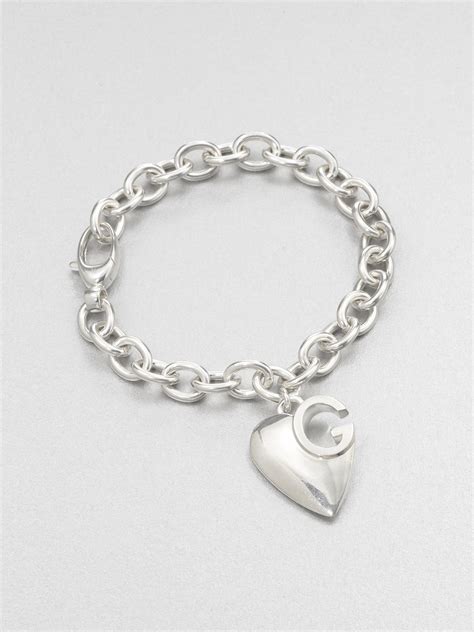 gucci 1973 silver heart charm bracelet|silver bracelet with interlocking g.